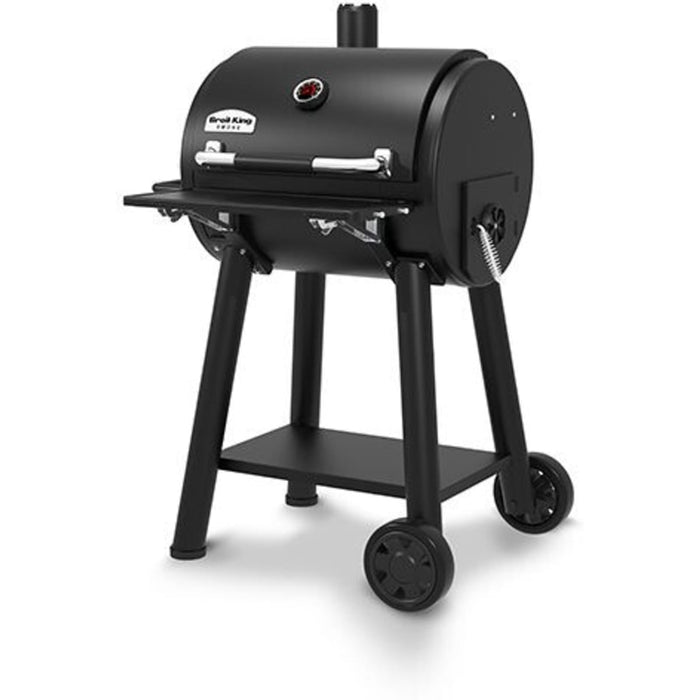 Broil King Regal REGAL 400 Freestanding Charcoal Grill Smoker with 500 sq. in. Primary Cooking Surface, Heavy-Duty Cast Iron Grids, Crack-Proof Wheels, Bottle Opener, Lower Shelf, Removable Stainless Steel Ash Trays, and Accu-Temp™ Thermometer