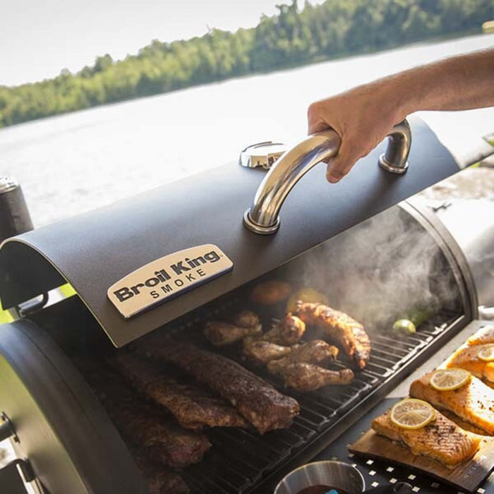 Broil King Regal REGAL 400 Freestanding Charcoal Grill Smoker with 500 sq. in. Primary Cooking Surface, Heavy-Duty Cast Iron Grids, Crack-Proof Wheels, Bottle Opener, Lower Shelf, Removable Stainless Steel Ash Trays, and Accu-Temp™ Thermometer